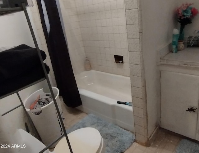 bathroom with toilet and shower / bathtub combination with curtain