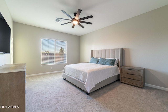 bedroom featuring ceiling fan and light carpet