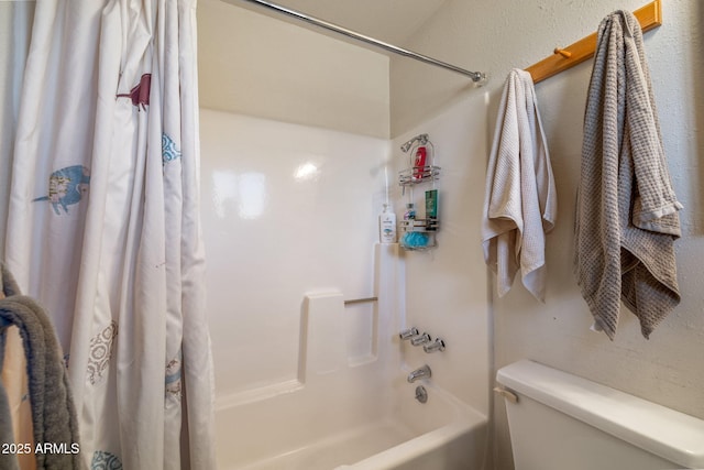 bathroom with toilet and shower / tub combo