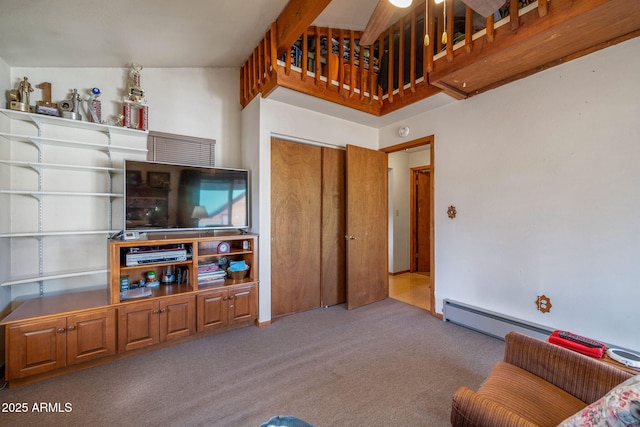 carpeted living room featuring baseboard heating