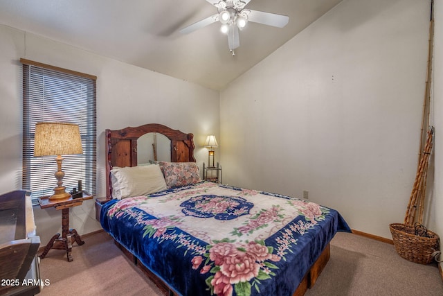 carpeted bedroom with ceiling fan and vaulted ceiling