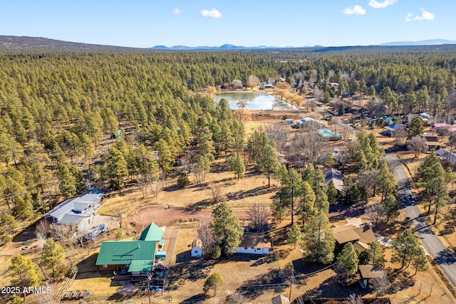 aerial view featuring a water and mountain view