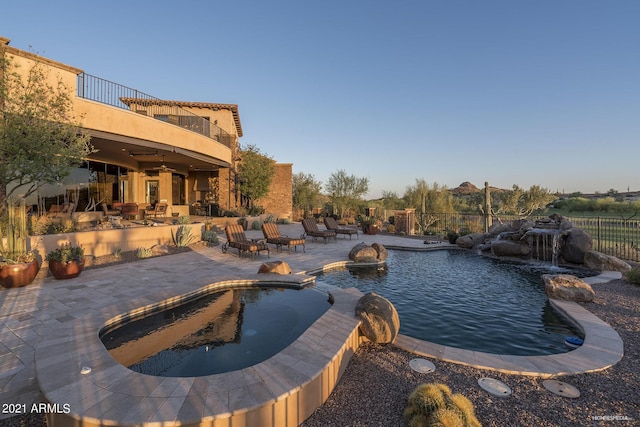 9161 E Superstition Mountain Dr, Gold Canyon, AZ 85118 - view of pool with a patio, ceiling fan, and pool water feature