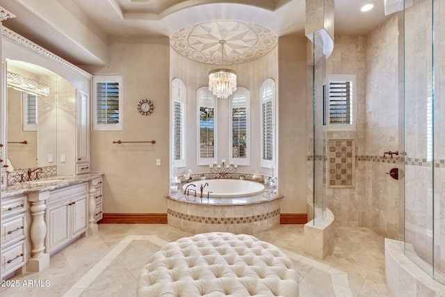 9161 E Superstition Mountain Dr, Gold Canyon, AZ 85118 - bathroom featuring a chandelier, shower with separate bathtub, and vanity