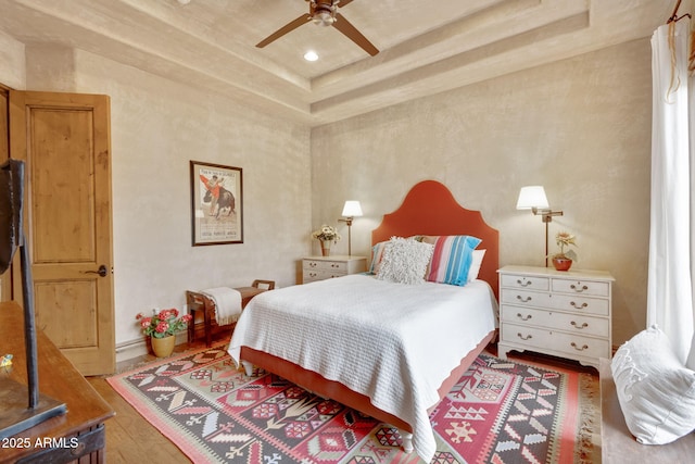 9161 E Superstition Mountain Dr, Gold Canyon, AZ 85118 - bedroom with hardwood / wood-style flooring, ceiling fan, and a tray ceiling