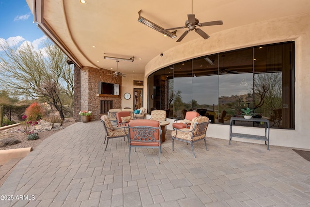 9161 E Superstition Mountain Dr, Gold Canyon, AZ 85118 - view of patio with ceiling fan and an outdoor living space with a fireplace