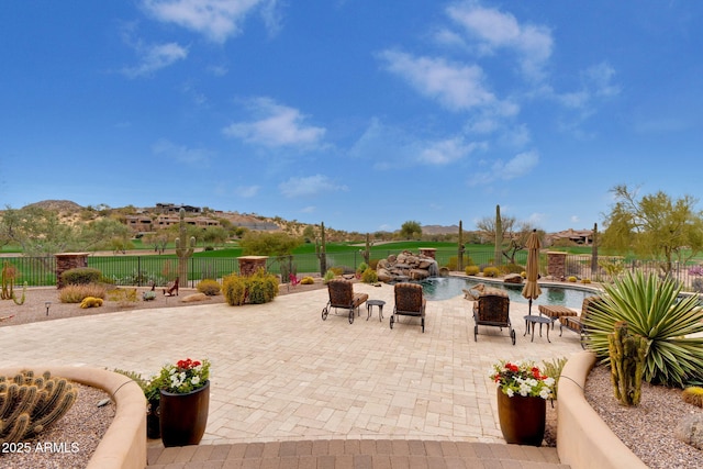 9161 E Superstition Mountain Dr, Gold Canyon, AZ 85118 - view of patio with a mountain view, pool water feature, and a fenced in pool