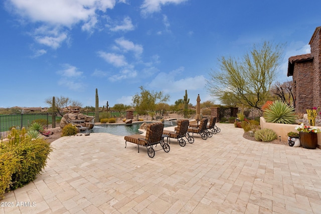9161 E Superstition Mountain Dr, Gold Canyon, AZ 85118 - view of patio / terrace with a swimming pool with hot tub and pool water feature