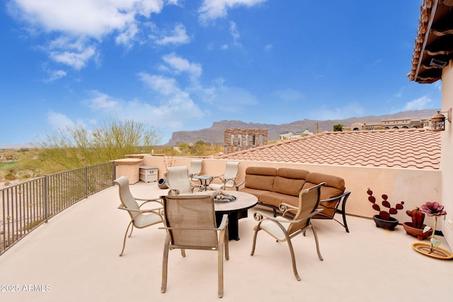 9161 E Superstition Mountain Dr, Gold Canyon, AZ 85118 - view of patio with a mountain view, a balcony, and a fire pit