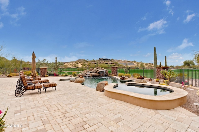 9161 E Superstition Mountain Dr, Gold Canyon, AZ 85118 - view of pool featuring pool water feature, an in ground hot tub, and a patio area