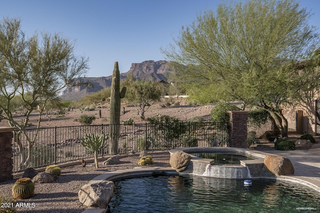 9161 E Superstition Mountain Dr, Gold Canyon, AZ 85118 - view of swimming pool with an in ground hot tub and a mountain view