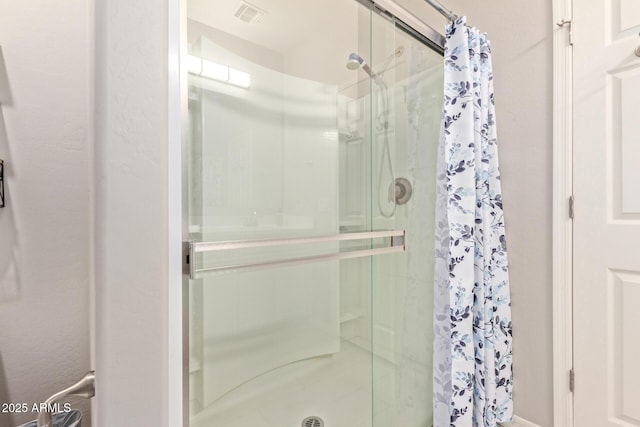 bathroom featuring a shower with curtain