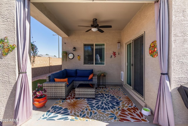 view of patio featuring ceiling fan and an outdoor living space