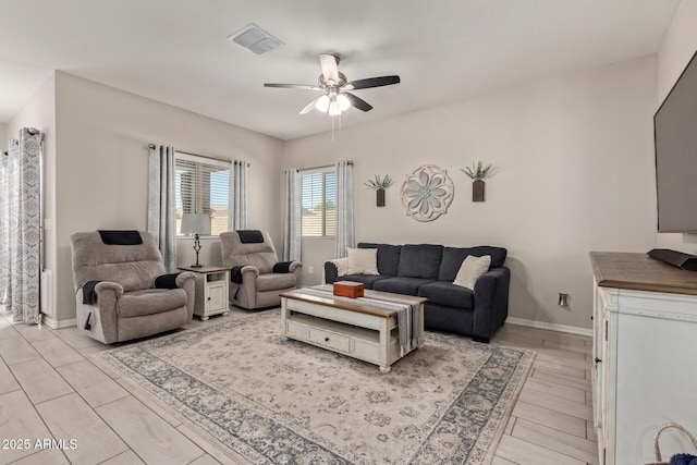 living room featuring ceiling fan