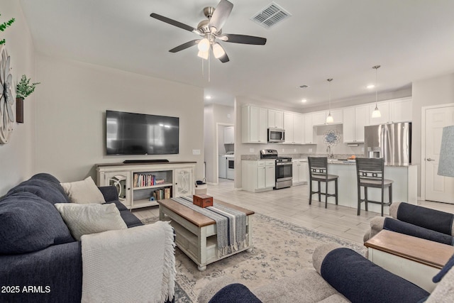 living room featuring ceiling fan