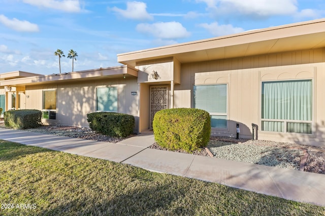 exterior space with a front lawn