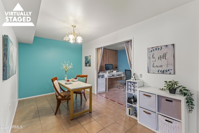 dining room with light tile patterned floors and a notable chandelier