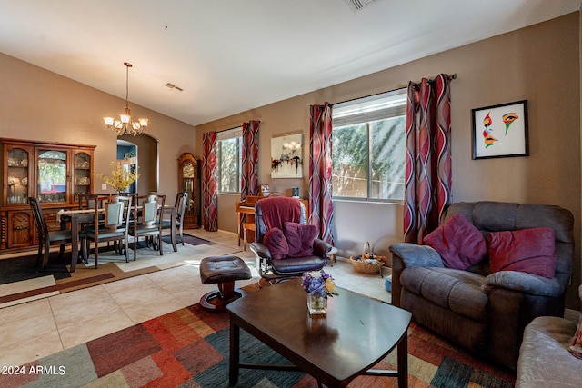 tiled living room featuring vaulted ceiling and an inviting chandelier