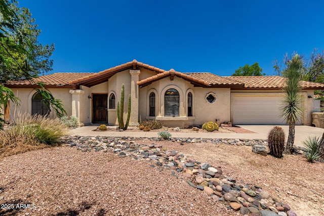 16216 N Runyon Pl, Fountain Hills, AZ 85268 - mediterranean / spanish house with a tile roof, stucco siding, and a garage