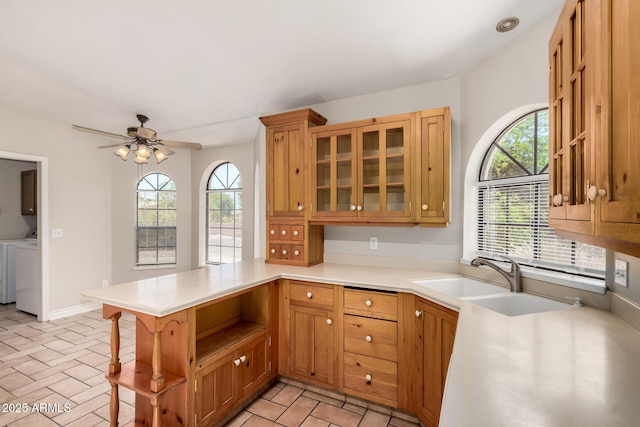 16216 N Runyon Pl, Fountain Hills, AZ 85268 - kitchen with a peninsula, washing machine and dryer, light countertops, ceiling fan, and a sink