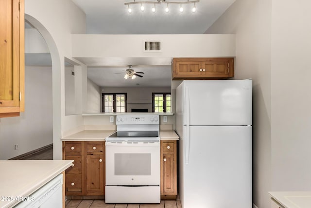 16216 N Runyon Pl, Fountain Hills, AZ 85268 - kitchen featuring white appliances, a ceiling fan, brown cabinetry, and light countertops