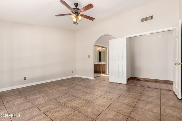 16216 N Runyon Pl, Fountain Hills, AZ 85268 - unfurnished room featuring a ceiling fan, arched walkways, tile patterned floors, and baseboards