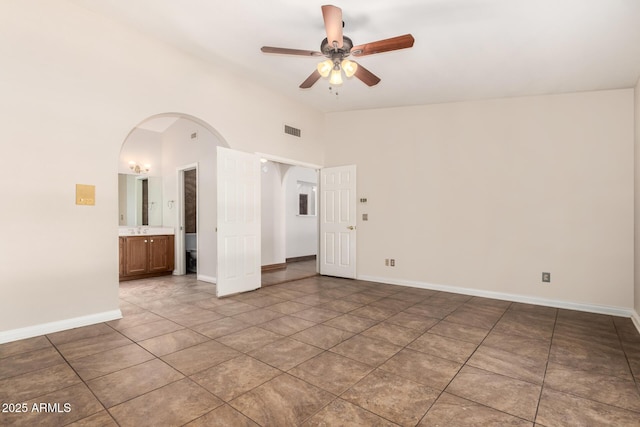 16216 N Runyon Pl, Fountain Hills, AZ 85268 - spare room with arched walkways, a ceiling fan, tile patterned flooring, and a sink