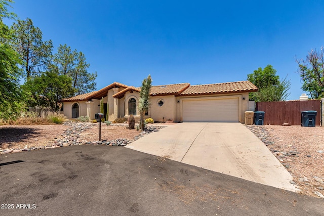 16216 N Runyon Pl, Fountain Hills, AZ 85268 - mediterranean / spanish home with a garage, a tile roof, driveway, and stucco siding