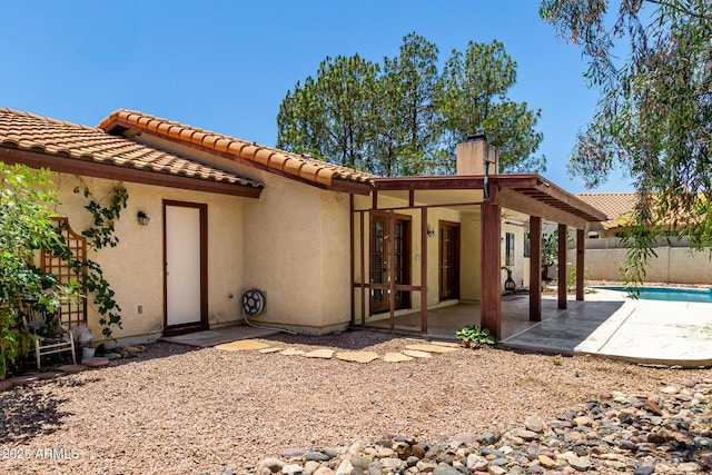 16216 N Runyon Pl, Fountain Hills, AZ 85268 - back of house with a patio area, a chimney, stucco siding, and a tile roof