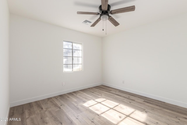 spare room with light hardwood / wood-style floors and ceiling fan