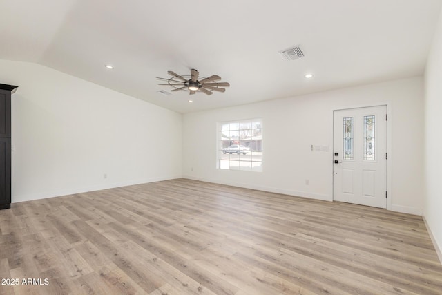 unfurnished living room featuring light wood-type flooring, ceiling fan, and lofted ceiling