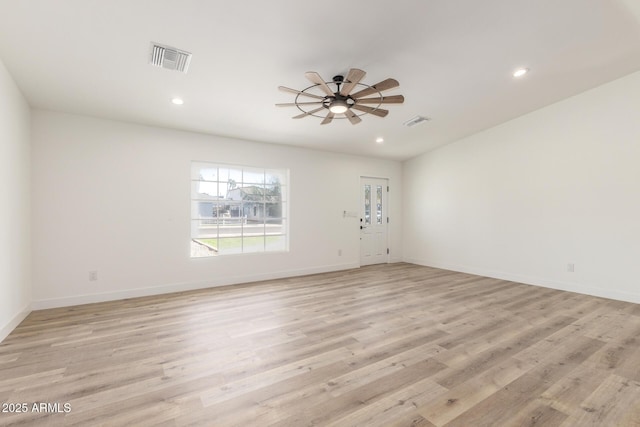 unfurnished room with ceiling fan and light wood-type flooring