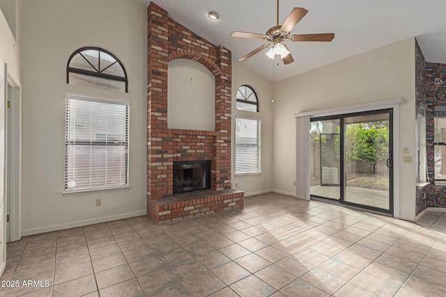 unfurnished living room with high vaulted ceiling, light tile patterned floors, ceiling fan, and a fireplace