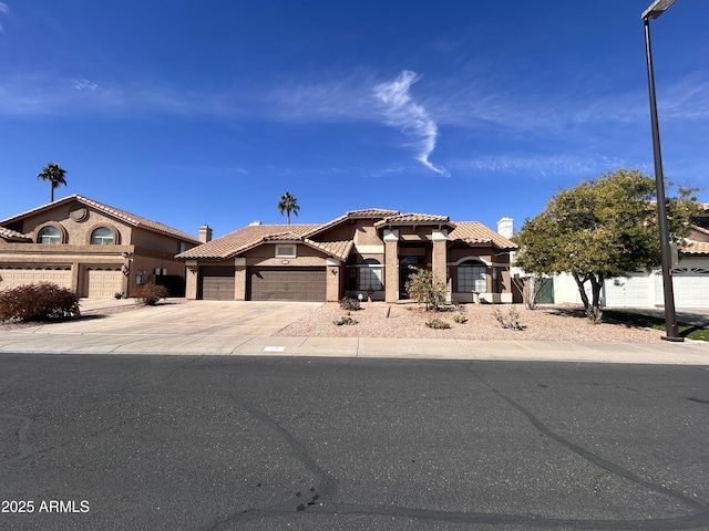 mediterranean / spanish-style home with a garage