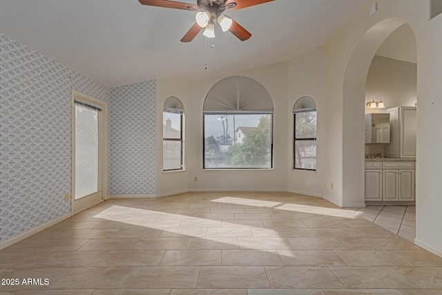 unfurnished room featuring light tile patterned floors and ceiling fan