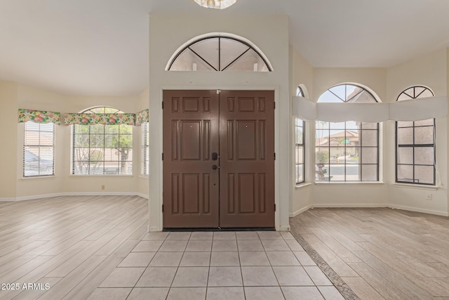 entrance foyer featuring plenty of natural light and light hardwood / wood-style floors