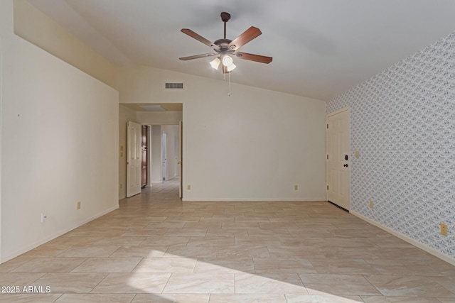 unfurnished room featuring vaulted ceiling and ceiling fan