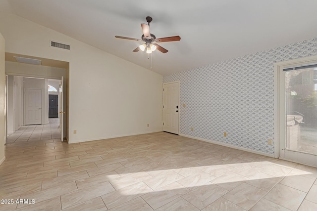 spare room with vaulted ceiling and ceiling fan