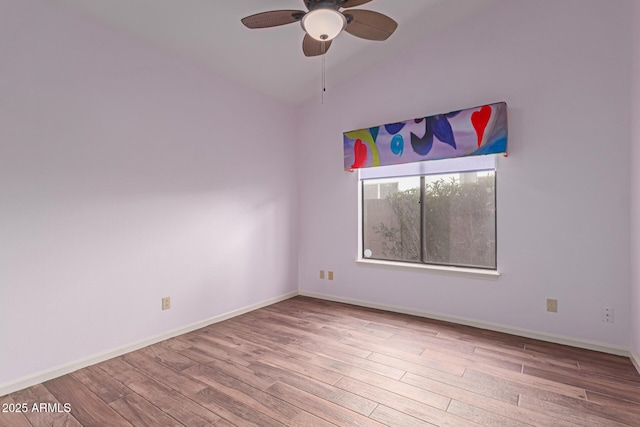 unfurnished room with ceiling fan, light hardwood / wood-style flooring, and vaulted ceiling