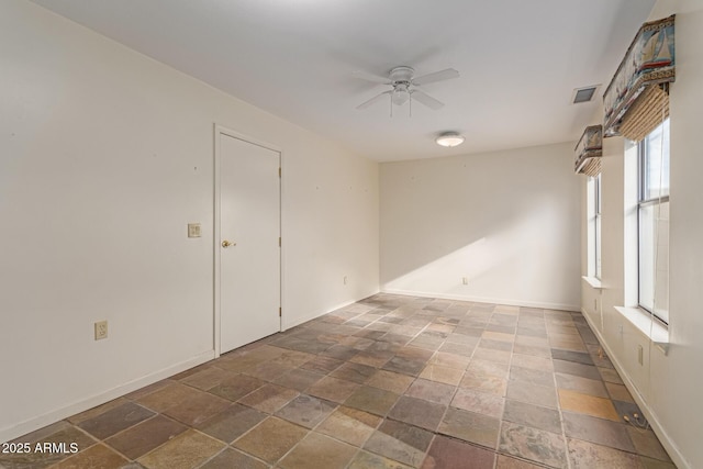 spare room with ceiling fan