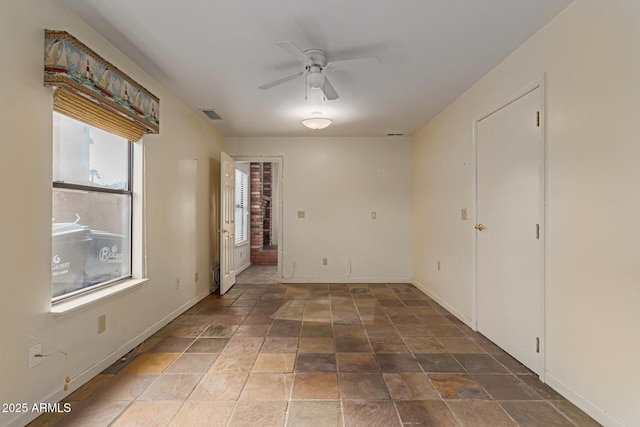 unfurnished room featuring ceiling fan