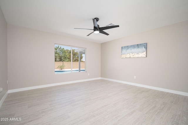 4506 W Golden Ln, Glendale, AZ 85302 - spare room featuring ceiling fan, baseboards, visible vents, and light wood-style floors
