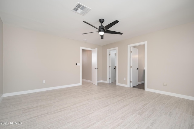 4506 W Golden Ln, Glendale, AZ 85302 - spare room with light wood finished floors, visible vents, ceiling fan, and baseboards