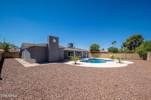 4506 W Golden Ln, Glendale, AZ 85302 - view of swimming pool with cooling unit, a fenced in pool, a fenced backyard, and a patio area