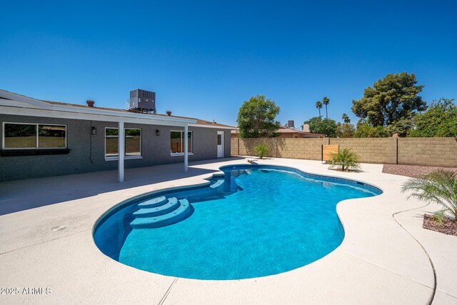 4506 W Golden Ln, Glendale, AZ 85302 - view of swimming pool featuring fence, cooling unit, a patio area, and a fenced in pool