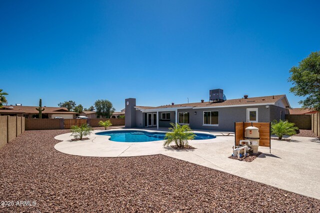 4506 W Golden Ln, Glendale, AZ 85302 - view of pool with a fenced backyard, central air condition unit, a fenced in pool, and a patio area