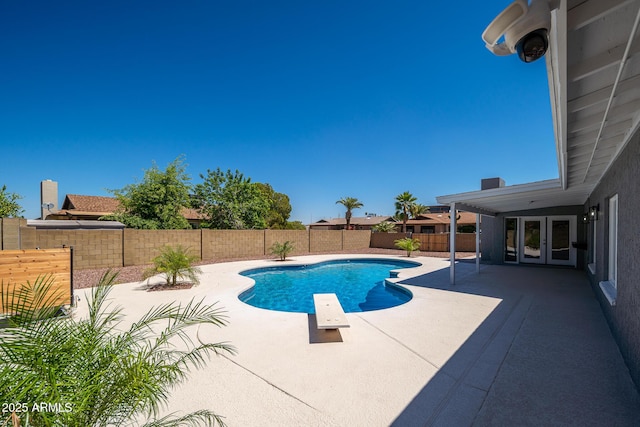4506 W Golden Ln, Glendale, AZ 85302 - view of swimming pool with a fenced backyard, a fenced in pool, french doors, and a patio area