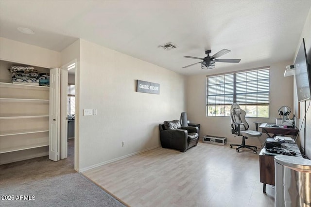 office featuring ceiling fan and light hardwood / wood-style floors