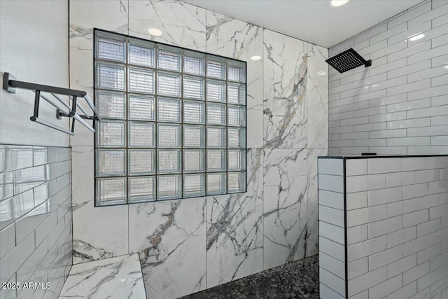 bathroom with a tile shower