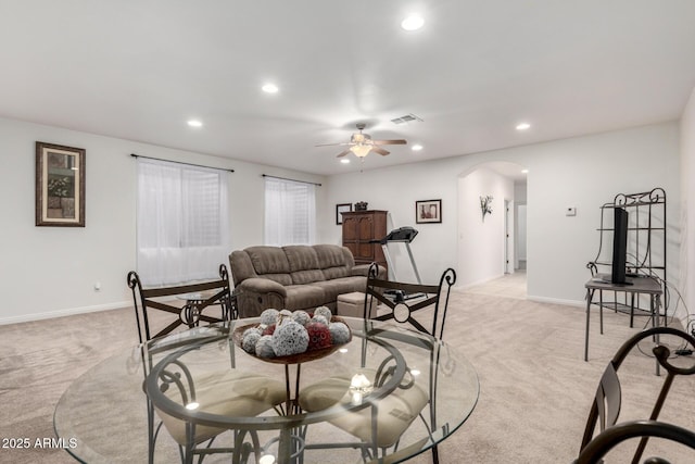 living room featuring ceiling fan and light carpet